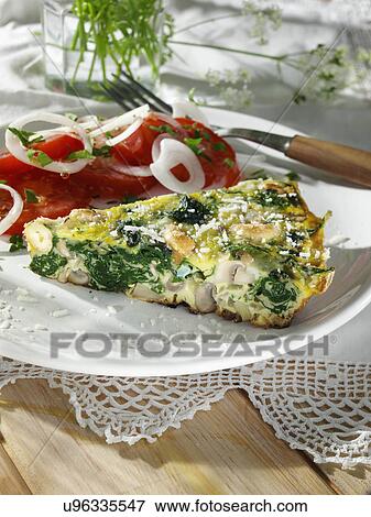Stock Photo - Frittata with mushrooms spinach onions and cashews. Fotosearch