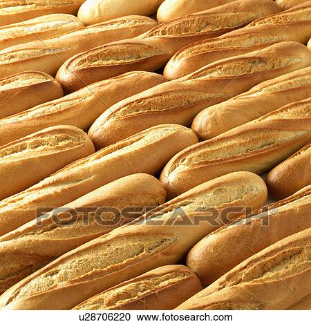 Stock Image - Full Frame Of Freshly Baked Baguettes. Fotosearch