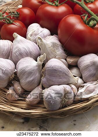 Garlic and red ripe tomatoes in a wicker basket View Large Photo Image Stock Image - Garlic and red ripe tomatoes in a wicker basket. Fotosearch