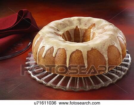 Stock Photograph - Glazed orange bundt cake. Fotosearch