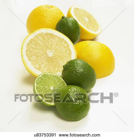 Stock Image - Grapefruit And Limes On White Background. Fotosearch