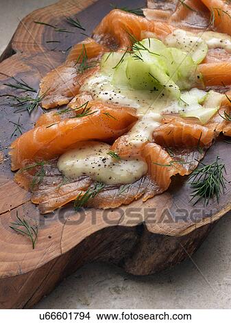 Gravlax smoked salmon with dill cucumber mustard dressing Marco Pierre White recipe View Large Photo Image Picture - Gravlax smoked salmon with dill cucumber mustard dressing Marco Pierre White recipe. Fotosearch