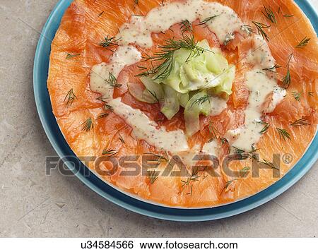 Gravlax smoked salmon with dill cucumber mustard dressing Marco Pierre White recipe View Large Photo Image Stock Photograph - Gravlax smoked salmon with dill cucumber mustard dressing Marco Pierre White recipe. Fotosearch