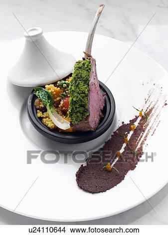 Picture - Herb crust Moroccan lamb chops with vegetable tagine. Fotosearch