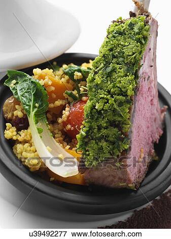 Herb crust Moroccan lamb chops with vegetable tagine View Large Photo Image Stock Photo - Herb crust Moroccan lamb chops with vegetable tagine. Fotosearch