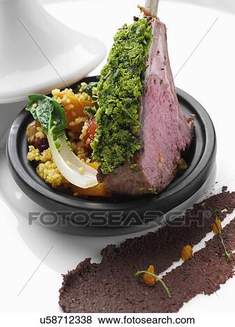 Herb crust Moroccan lamb chops with vegetable tagine View Large Photo Image Stock Photo - Herb crust Moroccan lamb chops with vegetable tagine. Fotosearch