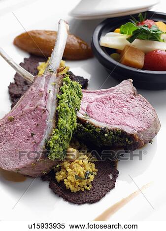 Herb crust Moroccan lamb chops with vegetable tagine View Large Photo Image Stock Photography - Herb crust Moroccan lamb chops with vegetable tagine. Fotosearch