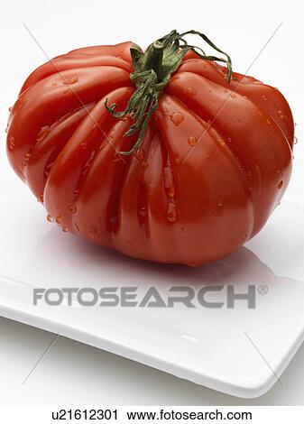 Heritage beefsteak tomato View Large Photo Image Stock Image - Heritage beefsteak tomato. Fotosearch
