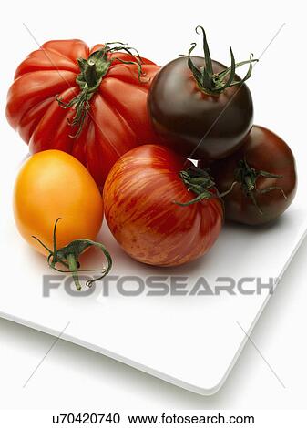 Stock Image - Heritage beefsteak yellow banana tomato. Fotosearch