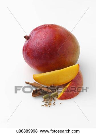 Stock Photo - Honey mango with cinnamon cardomon fennel fenugreek cumin. Fotosearch