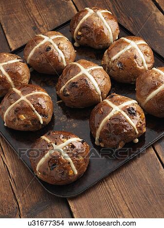 Picture - Hot cross buns on a baking sheet. Fotosearch