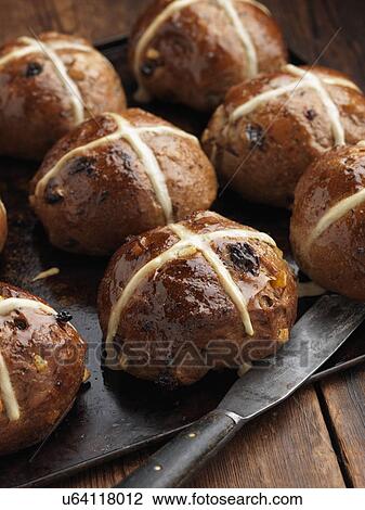 Hot cross buns on a baking sheet View Large Photo Image Stock Image - Hot cross buns on a baking sheet. Fotosearch