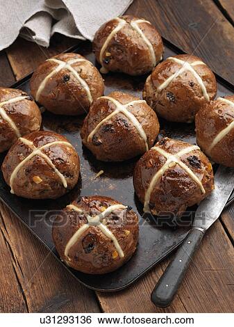 Hot cross buns on a baking sheet View Large Photo Image Stock Photograph - Hot cross buns on a baking sheet. Fotosearch