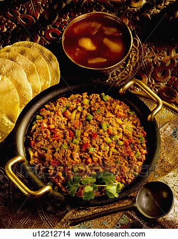 Picture - Indian Curry Dish With Mango Chutney And Pompadoms. Fotosearch