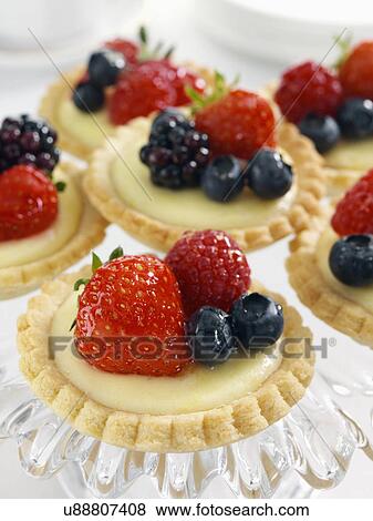 Stock Photo - Individual fruit tarts. Fotosearch