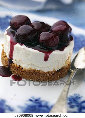 Individual gluten free cherry cheesecake on an antique plate View Large Photo Image Stock Photo - Individual gluten free cherry cheesecake on an antique plate. Fotosearch