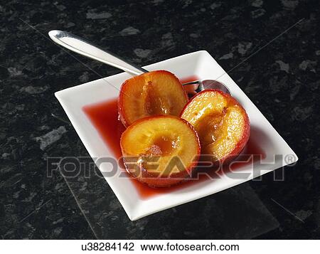 Individual portion of Boozy plums dessert View Large Photo Image Stock Image - Individual portion of Boozy plums dessert. Fotosearch