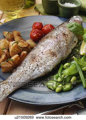 Stock Photo - Individual portion of broiled rainbow trout and saute potatoes tomatoes with green bean salad. Fotosearch