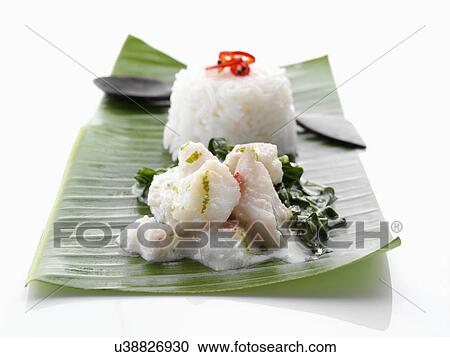 Stock Image - Individual portion of Fish Amok Cambodian cuisine. Fotosearch
