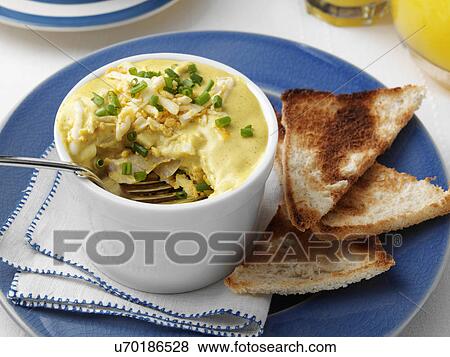 Individual portion of gourmet kedgeree in a white ramekin View Large Photo Image Stock Photo - Individual portion of gourmet kedgeree in a white ramekin. Fotosearch