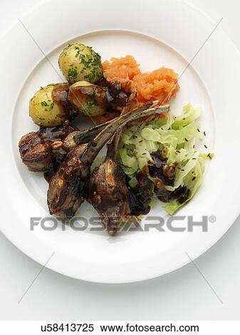Individual portion of lamb ribs new potatoes cabbage and carrot swede mash View Large Photo Image Stock Photography - Individual portion of lamb ribs new potatoes cabbage and carrot swede mash. Fotosearch