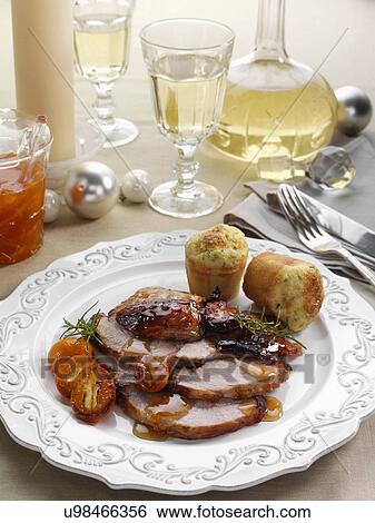 Individual portion of leg of pork slices with kumquat marmalade glaze and cheese chive muffins main meals View Large Photo Image Stock Photograph - Individual portion of leg of pork slices with kumquat marmalade glaze and cheese chive muffins main meals. Fotosearch