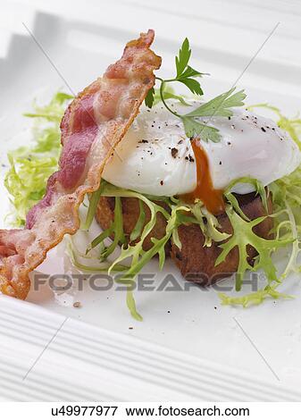 Stock Photo - Individual portion of salad Lyonnais. Fotosearch