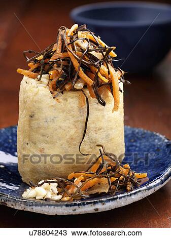 Stock Image - Individual portion rice pouch with carrot salad. Fotosearch