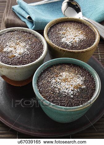 Stock Photography - Individual portions of banana fudge pudding. Fotosearch