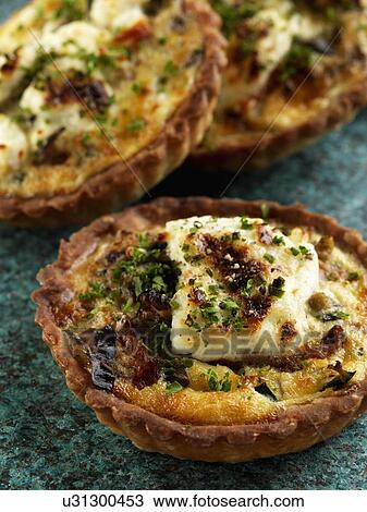 Individual smoked salmon tarts and goats cheese tarts View Large Photo Image Stock Image - Individual smoked salmon tarts and goats cheese tarts. Fotosearch