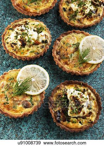 Individual smoked salmon tarts and goats cheese tarts View Large Photo Image Stock Photo - Individual smoked salmon tarts and goats cheese tarts. Fotosearch