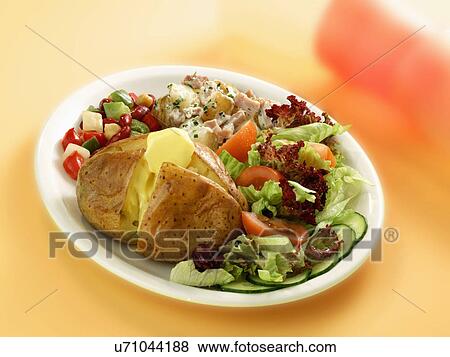 Stock Photo - Jacket Potato With Salad On Plate. Fotosearch