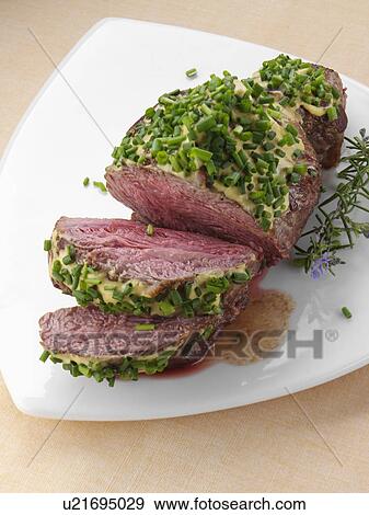 Lamb rump with a herb crust View Large Photo Image Stock Photo - Lamb rump with a herb crust. Fotosearch