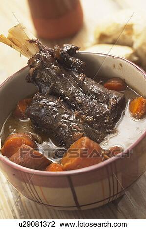 Lamb Shank Served With Winter Vegetables View Large Photo Image Stock Image - Lamb Shank Served With Winter Vegetables. Fotosearch