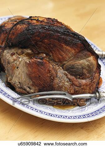 Leg of pork whole rolled boned glazed joint View Large Photo Image Stock Image - Leg of pork whole rolled boned glazed joint. Fotosearch