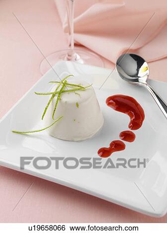 Stock Photograph - Lime and coconut panna cotta with raspberry coulis. Fotosearch