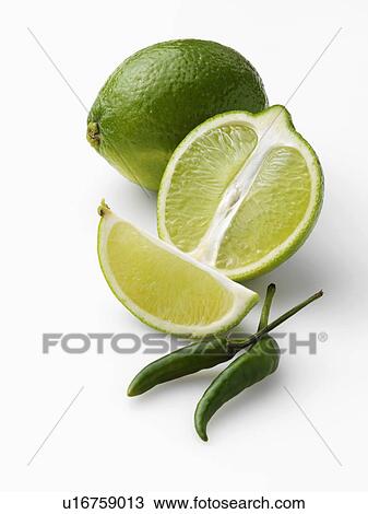 Limes and chillies on a white background View Large Photo Image Stock Image - Limes and chillies on a white background. Fotosearch