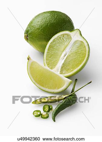 Limes and chillies on a white background View Large Photo Image Stock Image - Limes and chillies on a white background. Fotosearch