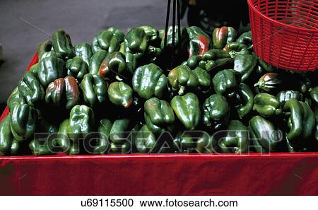 Stock Image - Local market stall, Provence, France. Green peppers capsicums.. Fotosearch