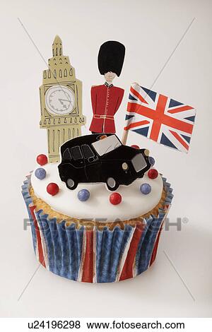 London Themed British Celebration Cupcake, White Iced Sponge Fairy Cake, Topped With Red And Blue Sprinkles Small Union Jack Flag, Big Ben, London Taxi And Guardsman, On White View Large Photo Image Stock Photo - London Themed British Celebration Cupcake, White Iced Sponge Fairy Cake, Topped With Red And Blue Sprinkles Small Union Jack Flag, Big Ben, London Taxi And Guardsman, On White. Fotosearch