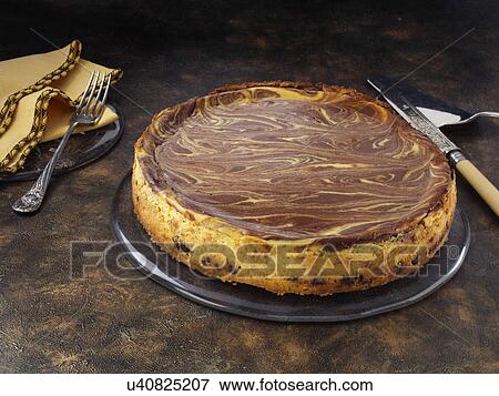 Stock Photo - Marbled pumpkin cheesecake. Fotosearch
