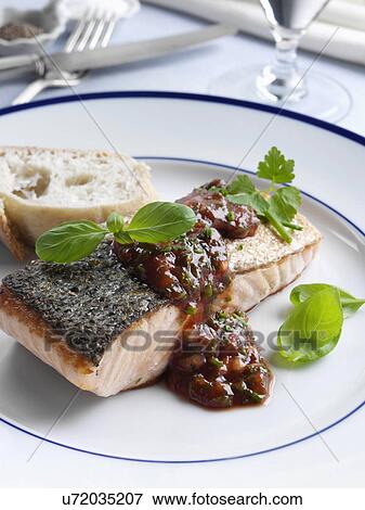 Marco Pierre White recipe salmon fillet with tomato sauce and herbs View Large Photo Image Stock Photo - Marco Pierre White recipe salmon fillet with tomato sauce and herbs. Fotosearch