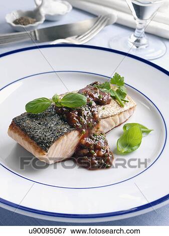 Marco Pierre White recipe salmon fillet with tomato sauce and herbs View Large Photo Image Stock Photo - Marco Pierre White recipe salmon fillet with tomato sauce and herbs. Fotosearch