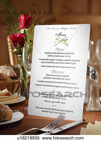 Stock Photography - Menu in restaurant table setting. Fotosearch