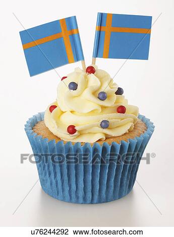 One Cupcake With Buttercream Topping Decorated With Two Swedish Flags, Blue Cake Case, On White View Large Photo Image Stock Image - One Cupcake With Buttercream Topping Decorated With Two Swedish Flags, Blue Cake Case, On White. Fotosearch