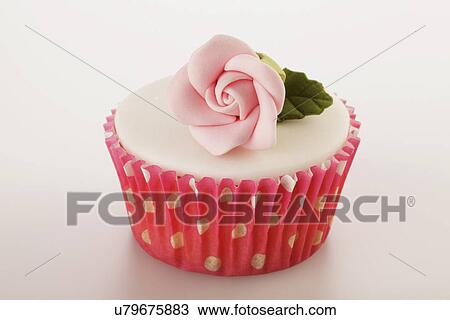 One Perfect White Iced Cupcakes In Pink Polka Dot Cake Case Decorated With Single Pink Sugar Craft Rose, On White Tabletop View Large Photo Image Stock Image - One Perfect White Iced Cupcakes In Pink Polka Dot Cake Case Decorated With Single Pink Sugar Craft Rose, On White Tabletop. Fotosearch