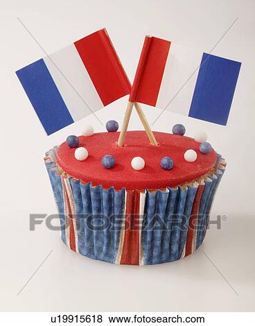 One Red Iced Cupcake With Two French Flags On Top View Large Photo Image Stock Photo - One Red Iced Cupcake With Two French Flags On Top. Fotosearch