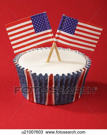 One White Iced Cupcake Decorated With Two Small American Flags, On Red Background View Large Photo Image Stock Image - One White Iced Cupcake Decorated With Two Small American Flags, On Red Background. Fotosearch
