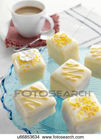 Orange flavoured fondant fancies View Large Photo Image Picture - Orange flavoured fondant fancies. Fotosearch