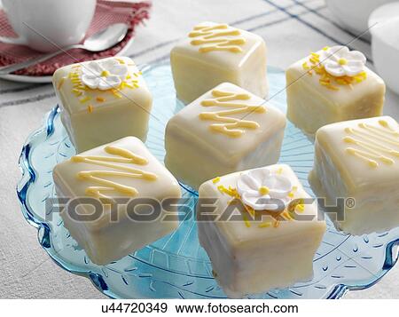 Stock Photo - Orange flavoured fondant fancies. Fotosearch
